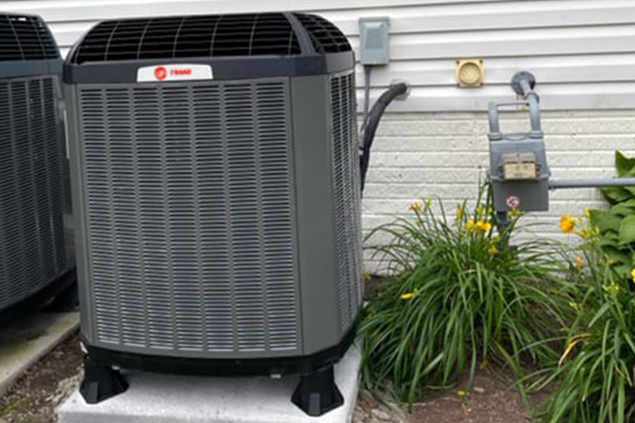 BIM Heating and Cooling servicing Trane outdoor unit for total home comfort