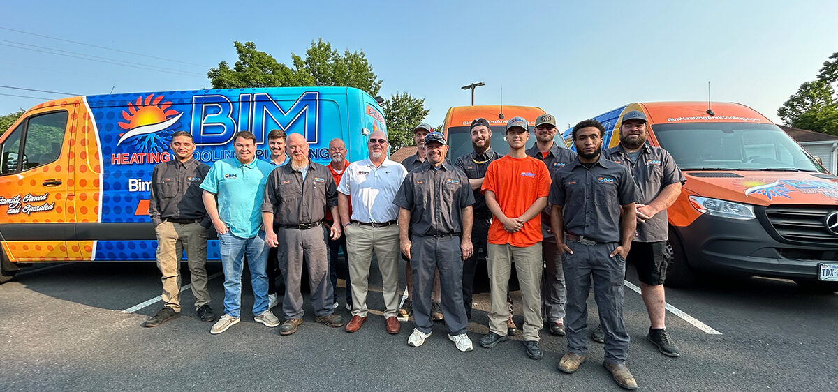 BIM Heating and Cooling team group photo at office, HVAC technicians and staff
